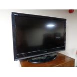 A Toshiba 37 inch LCD TV with remote