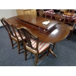 A Regency style twin pedestal dining table,