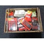 A crate of new tools, drill bits, nail punches,