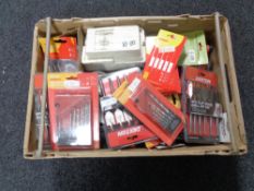 A crate of new tools, drill bits, nail punches,