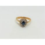 An 18ct gold sapphire and diamond cluster ring, size O CONDITION REPORT: 3.