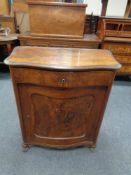A nineteenth century continental walnut cabinet fitted cupboard and drawer