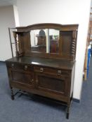 An Edwardian oak mirror backed sideboard