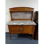 A late Victorian inlaid mahogany marble topped washstand