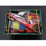 A crate of new tools, screw driver set, hand saw, brass door knocker,