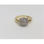 An 18ct gold diamond cluster ring, size K CONDITION REPORT: 3.