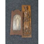 A carved oak panel depicting a lady carrying wheat together with an Edwardian oak framed black and