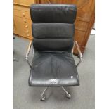 A Vitra Charles Eames designed soft pad executive swivel office chair upholstered in black leather