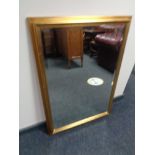 A gilt framed bevelled overmantel mirror