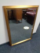 A gilt framed bevelled overmantel mirror