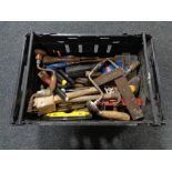 A crate of assorted vintage hand tools