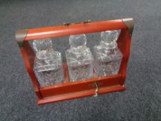 Three cut glass whisky decanters in Tantalus