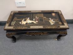 An oriental lacquered hardstone inlaid coffee table