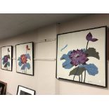 A set of three Jim Thompson silk panels depicting flowers