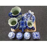 A tray of reproduction Staffordshire and Oriental blue and white china, wash jug, candlestick,