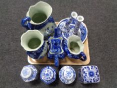 A tray of reproduction Staffordshire and Oriental blue and white china, wash jug, candlestick,