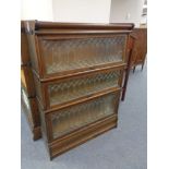 An early twentieth century oak three tier leaded glass stacking bookcase CONDITION