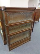 An early twentieth century oak three tier leaded glass stacking bookcase CONDITION
