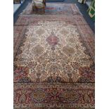 A Persian design fringed carpet