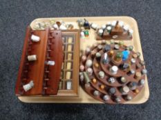 A tray of three wooden thimble display stands,