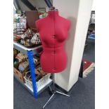 An adjustable dress makers dummy on stand
