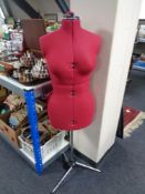 An adjustable dress makers dummy on stand