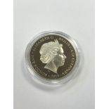 A silver proof £5 coin commemorating D-Day