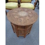 A heavily carved anglo Indian octagonal occasional table with bone inlay