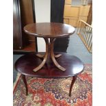 A continental oak pedestal oval dining table