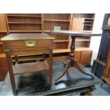 A campaign style leather topped lamp table fitted with a drawer together with a leather topped