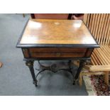 A nineteenth century continental burr walnut and ebonised work table