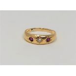 An 18ct gold diamond and garnet ring, size O1/2 CONDITION REPORT: 2.