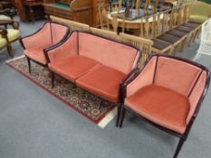 A three piece continental salon suite comprising of two seater settee and pair of armchairs