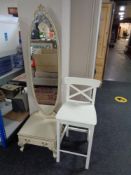 A cream and gilt cheval mirror and a bar stool