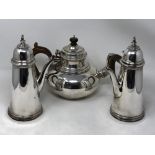 A Brittania silver teapot together with pair of coffee pots, 2295g.