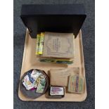 A tray of cigarette and tea card albums and cards