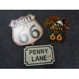 A cast iron Penny Lane street sign and two metal Route '66 signs