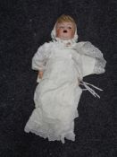 A Simon and Halbig porcelain headed doll with noise maker