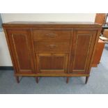 An early twentieth century oak sideboard fitted with drawers