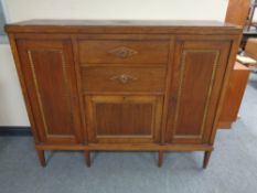 An early twentieth century oak sideboard fitted with drawers