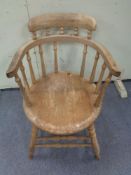 A nineteenth century beech spindle backed armchair (Af)