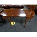 A Victorian mahogany D-end dining table with leaf