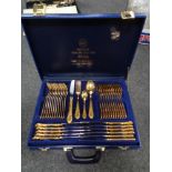 A Solingen gold plated cutlery set in blue leather case