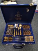 A Solingen gold plated cutlery set in blue leather case