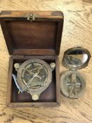 A reproduction nautical sextant in case, together with a further brass compass.