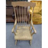 A nineteenth century beech spindle backed rocking chair (Af)