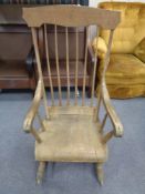 A nineteenth century beech spindle backed rocking chair (Af)