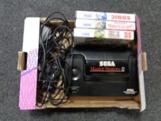 A Sega master system II with controller and leads together with three games - Chuck Rock,