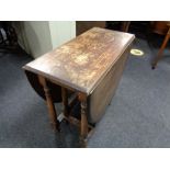 A 20th century oak gate leg table