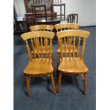 Four pine dining chairs